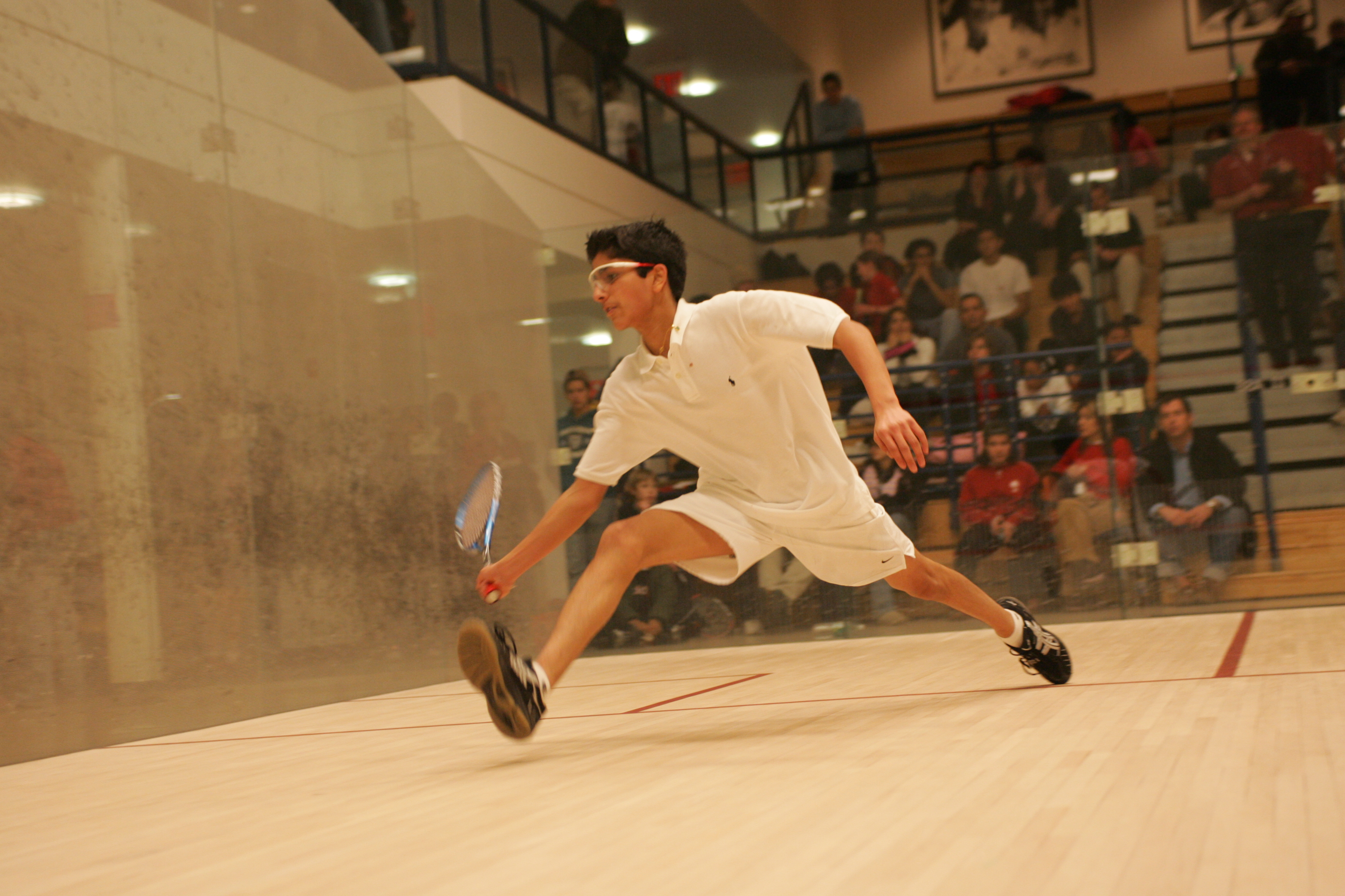 Arjun Gupta playing squash